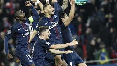 Paris Saint-Germain celebrate their victory over Barcelona in the Uefa Champions League last 16. Philippe Lopez / AFP