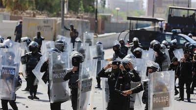 Riot police officers in Tahrir Square. EPA