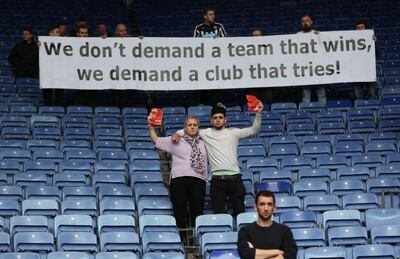 Newcastle fans protest at the club's owner's apparent lack of ambition. Alex Morton / Reuters