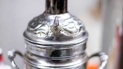 Embossed metal flasks used for making traditional Turkish coffee at Mr Al Khawaldi's stall.