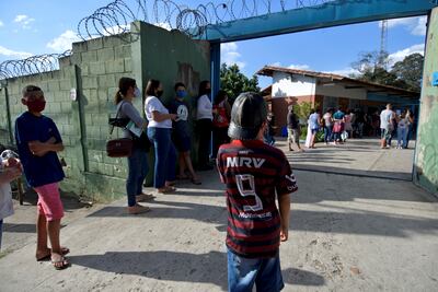 Pupils wait to receive a dose of the Pfizer-BioNTech vaccine at Barao do Rio Branco public school in Betim, Minas Gerais state, Brazil.