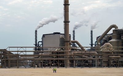 Emloyees walk outside the Maaden Aluminium Factory in Ras Al-Khair Industrial area near Jubail City in Saudi Arabia. AFP