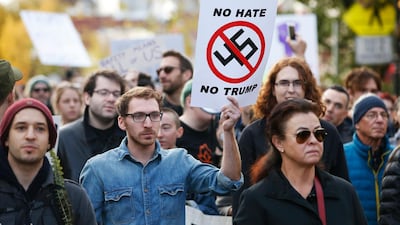 While President Trump is visiting, multiple groups of marchers make their way towards the Tree of Life synagogue. EPA