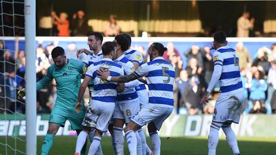 Queens Park Rangers goalkeeper Liam Kelly is mobbed by teammates after saving a Patrick Bamford penalty. QPR won 1-0 on January 18. PA