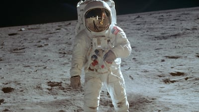 In this July 20, 1969 photo made available by NASA, astronaut Buzz Aldrin, lunar module pilot, walks on the surface of the moon during the Apollo 11 extravehicular activity. NASA via AP