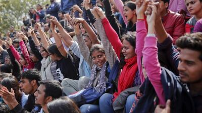 Indian students shout slogans during a protest at the Jawaharlal Nehru University against the arrest of a student union leader in New Delhi. Tsering Topgyal / AP Photo