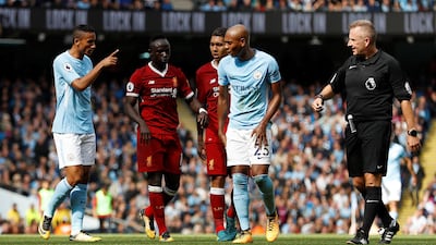 Liverpool's Sadio Mane, second fro left, is sent off by referee Jon Moss Action. Lee Smith / Reuters