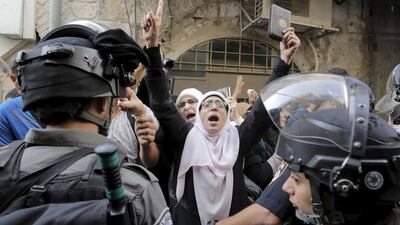 Israeli policemen prevent Palestinian women from entering the compound which houses Al Aqsa mosque, known to Muslims as the Noble Sanctuary and by Jews as the Temple Mount, in Jerusalem's Old City on September 13, 2015 as tensions flared ahead of the Jewish New Year. Ammar Awad/Reuters