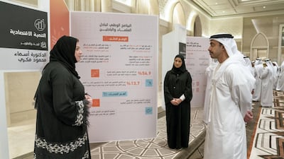 Sheikh Abdullah bin Zayed, Minister of Foreign Affairs and International Co-operation, listens to a Capstone project presentation by a National Experts Programme graduate.