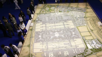 Visitors view a model of the Dubai World Central now known as Dubai South. Pawan Singh / The National