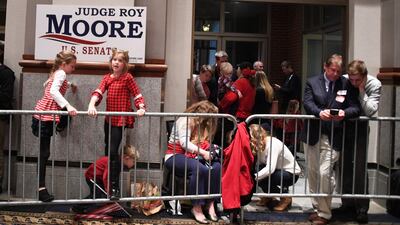 Supporters of Republican senatorial candidate Roy Moore wait for results at an election night party in Montgomery, Alabama, on December 12. Democrat Doug Jones scored a victory Tuesday in a fiercely contested US Senate race in conservative Alabama, dealing a setback to US President Donald Trump, whose candidate could not overcome damaging sexual misconduct accusations. Jim Watson / AFP Photo.