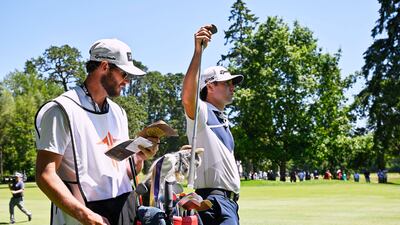 Matthew Wolff of the US grabs a club on the fifth hole. EPA