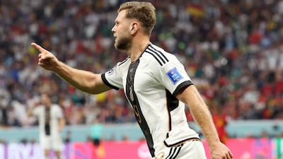 Germany's Niclas Fullkrug celebrates after scoring in the 1-1 Group E draw against Spain at Al Bayt Stadium on November 27, 2022 in Al Khor, Qatar. Getty