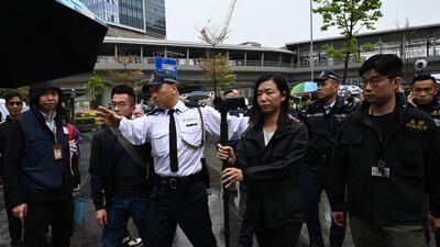 Police watch as a group of residents hold the first authorised protest and march in several years in Hong Kong. AFP