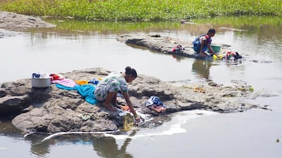 Women do their laundry in a stream at Nandore. Agriculture is a major contributor to india's economy and it provides livelihoods for many people, particularly in rural India.