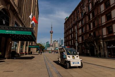 Police patrol in Nanjing street main pedestrian and shopping area, in Shanghai, China, on 28 March, after the city imposed a strict lockdown amid a Covid-19 resurgence. EPA
