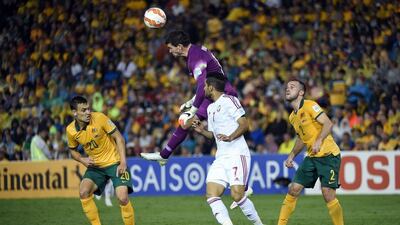 Australia goalkeeper Mathew Ryan, centre, clears the ball during the Asian Cup semi-final match against the UAE. Saeed Khan / AFP