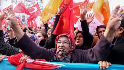 Supporters cheer during a campaign rally for Turkey's Justice and Development Party (AKP) in Ankara on March 28, 2019. AFP