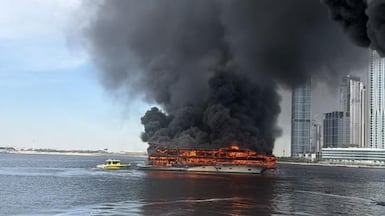 Heavy smoke resulted from a fire on a boat in Dubai Creek on Sunday. Dubai Media Office