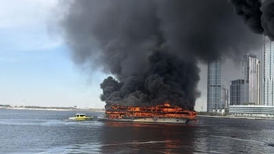 Heavy smoke resulted from a fire on a boat in Dubai Creek on Sunday. Dubai Media Office