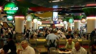 Patrons eat at a food court in the Mall of the Emirates, Dubai. Some nutritionists have advocated placing calorie counts on menus.