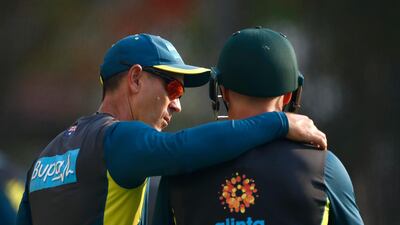 Justin Langer, left, with David Warner. Getty