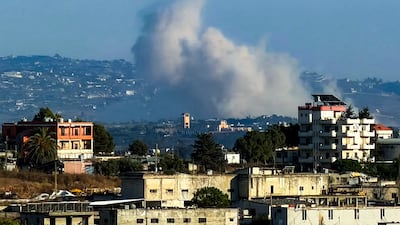 Smoke rises following explosions carried out by Israel in Deir Siryan in southern Lebanon on Tuesday. AFP