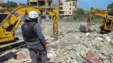 Rescuers clear rubble from buildings destroyed in the Lebanese town of Habboush, following Israeli strikes on Nabatieh governorate on May 2. Reuters