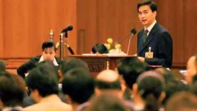 Abhisit Vejjajiva, the Thai prime minister, addresses lawmakers at the foreign ministry in Bangkok.