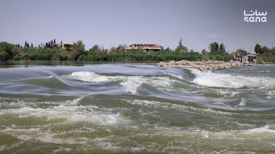 Surging floodwater in Deir Ezzor, Syria. Sana
