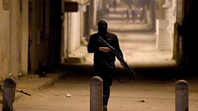Tunisian security forces track down protesters. Fethi Belaid / AFP Photo