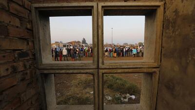 Some of the hundreds of people stand in line to cast their vote at a polling station in Bekkersdal, Johannesburg, South Africa, 07 May 2014. South Africans started voting in general elections expected to keep the ruling African National Congress in power, even if polls said it could lose votes over corruption and enduring poverty. About 25 million people were eligible to vote in the elections. Kim Ludbrook / EPA