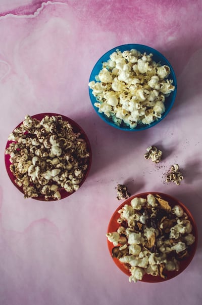 Gourmet popcorn can up the fun factor. Photo: Scott Price
