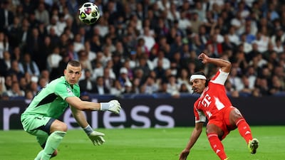 Bayern Munich's Serge Gnabry sees shot saved by Real keeper Andriy Lunin. Reuters