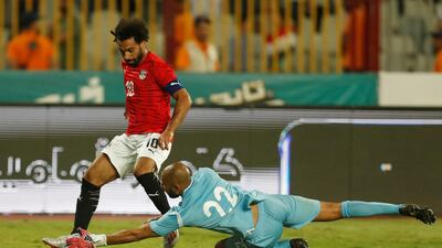 Salah in action with Guinea's Aly Keita. Reuters