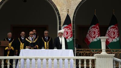 Afghan President Ashraf Ghani is sworn in by Chief Justice Sayed Yousuf Halim, during his inauguration ceremony at the presidential palace in Kabul. AP
