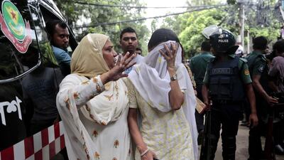 A relative tries to console a Bangladeshi woman Semin Rahman, whose son is missing after militants took hostages in a restaurant popular with foreigners in Dhaka, Bangladesh. Bangladeshi forces stormed the Holey Artisan Bakery in Dhaka’s Gulshan area where heavily armed militants held dozens of people hostage Saturday morning, rescuing some captives including foreigners at the end of the 10-hour standoff. AP Photo