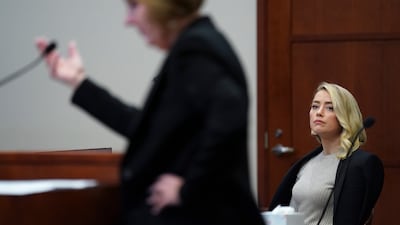 Heard listens as Ms Bredehoft questions her sister, Ms Henriquez. AP