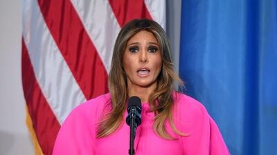 Melania Trump wore a shocking pink Delpozo dress during her speech to the spouses of world leaders at a United Nations luncheon. Don Emmert / AFP Photo