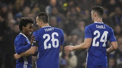 Willian celebrates scoring Chelsea’s third goal with John Terry and Gary Cahill. Tony O’Brien / Reuters