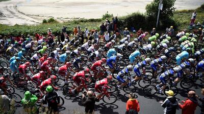 The pack rides along the sea during the 188km first stage of the 103rd Tour de France cycling race on July 2, 2016 between Mont Saint-Michel and Utah Beach, Normandy. Lionel Bonaventure / AFP