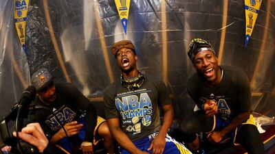 Harrison Barnes #40 of the Golden State Warriors and teammates celebrate in the locker room after they defeated the Cleveland Cavaliers 105 to 97 in Game Six of the 2015 NBA Finals at Quicken Loans Arena on June 16, 2015 in Cleveland, Ohio. Ezra Shaw/Getty Images