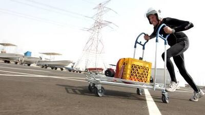 Expatriate Briton Steven Winstanley is training for a charity bobsled race in Austria using a shopping trolley carrying between 80kg and 90kg in Abu Dhabi.