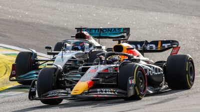George Russell attacks Max Verstappen during the sprint race. Getty