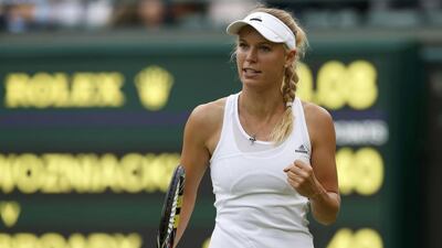Caroline Wozniacki of Denmark reacts during her women's singles match against Naomi Broady of Britain at the Wimbledon Tennis Championships in London on June 25, 2014. Suzanne Plunkett / Reuters