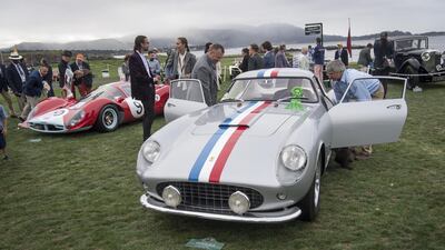 Attendees view a 1958 Ferrari NV 250 GT Scaglietti Berlinetta. Bloomberg