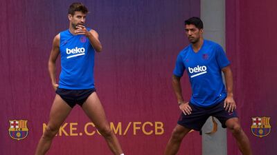 Gerard Pique, left, and Luis Suarez at training. EPA