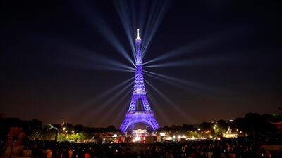 A light show is on display at the Eiffel tower in Paris, France. The Eiffel tower celebrates its 130th anniversary. EPA
