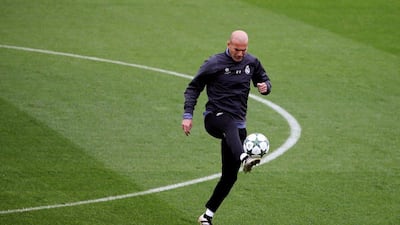 Real Madrid manager Zinedine Zidane controls the ball during training. Sergio Perez / Reuters