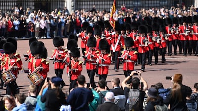 Tourists line the roads outside Buckingham Palace to watch the Changing of the Guard. London remains one of the world’s most iconic destinations. EPA